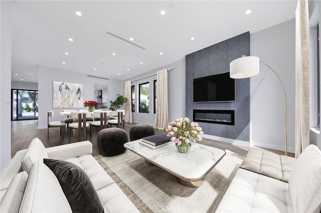 living room featuring hardwood / wood-style floors and a fireplace