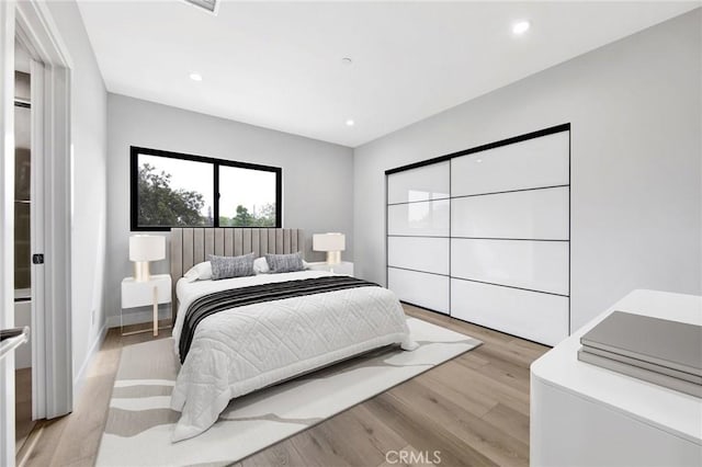 bedroom featuring light hardwood / wood-style floors