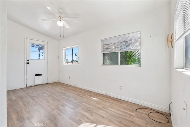 entryway featuring light wood-type flooring, lofted ceiling, and ceiling fan