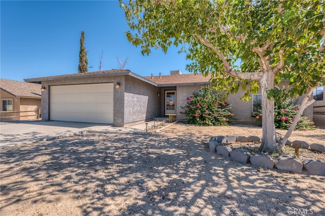 single story home with a garage