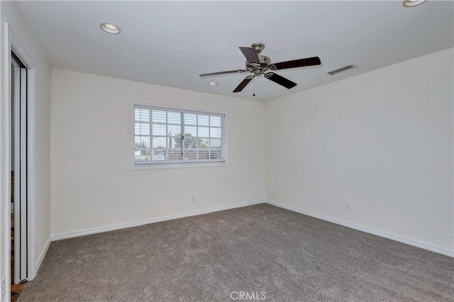 carpeted empty room with ceiling fan