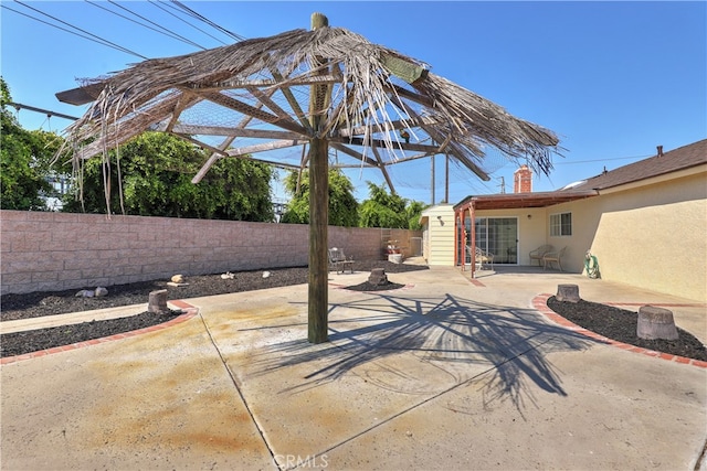 view of patio with a storage unit