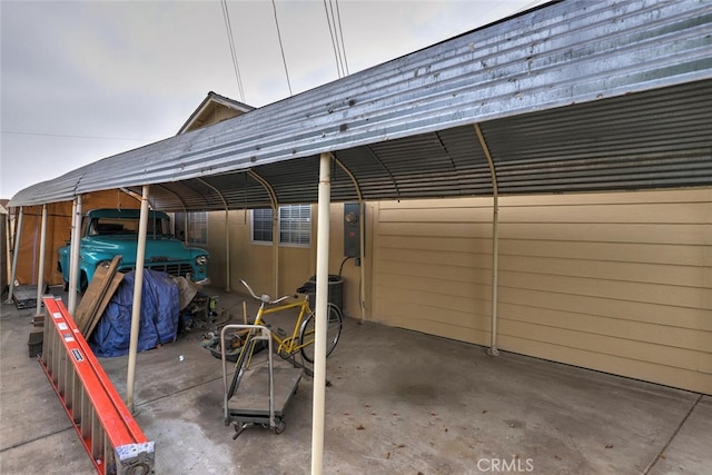 view of vehicle parking featuring a carport