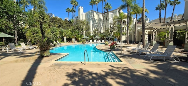 view of pool with a pergola and a patio area