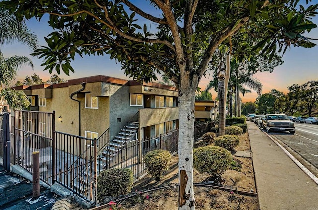 view of property with fence