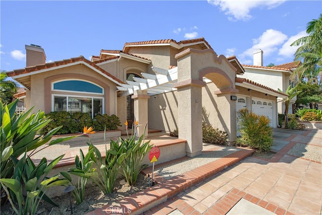 mediterranean / spanish house with a pergola