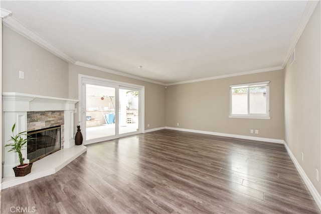 unfurnished living room featuring a wealth of natural light, hardwood / wood-style flooring, and a fireplace