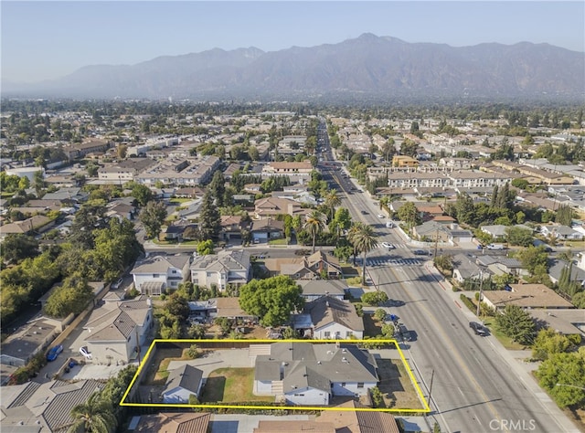 birds eye view of property featuring a mountain view