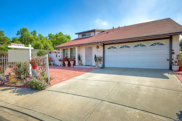 view of front of property featuring a garage