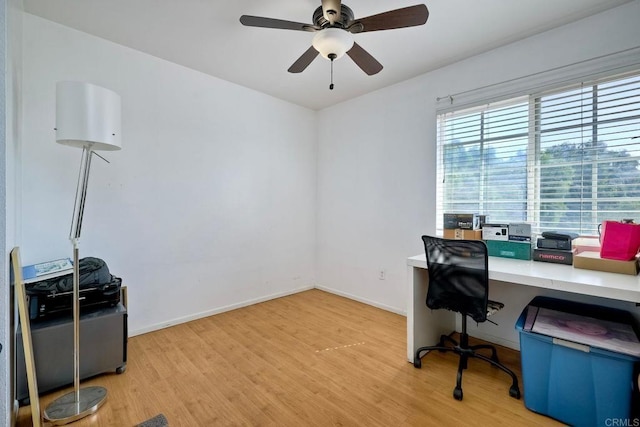 office space featuring light wood-type flooring and ceiling fan