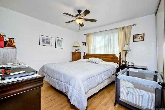 bedroom featuring light wood-type flooring and ceiling fan