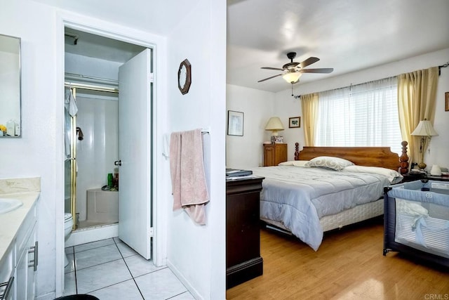 bedroom featuring ceiling fan and light hardwood / wood-style flooring