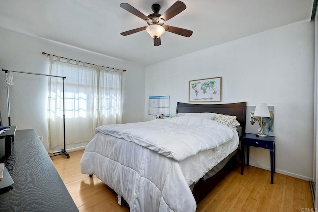 bedroom featuring ceiling fan and light wood-type flooring