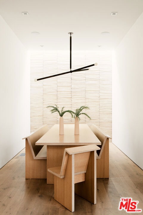 dining area with light hardwood / wood-style floors