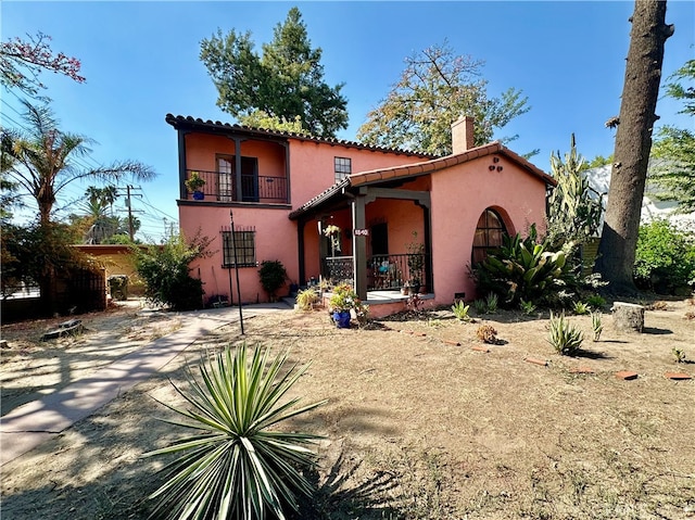 view of front of home with a balcony