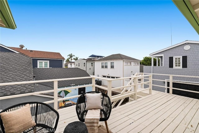 wooden terrace featuring a residential view