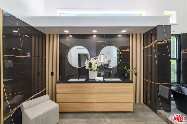 bathroom featuring vanity and concrete floors