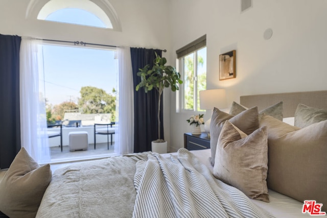 bedroom with a towering ceiling