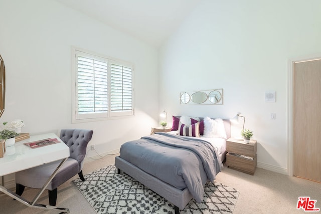 carpeted bedroom featuring vaulted ceiling