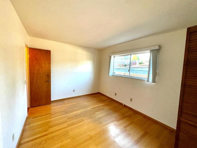 unfurnished room with light hardwood / wood-style floors