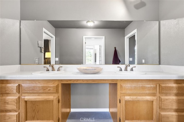 bathroom featuring tile patterned floors and vanity