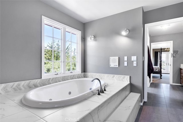 bathroom with tiled tub