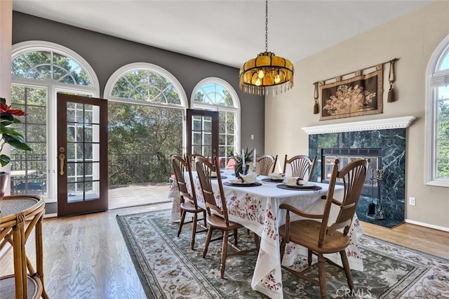 1385 Corberosa Dr, Arroyo Grande, CA 93420 - dining area featuring plenty of natural light, an inviting chandelier, and wood finished floors