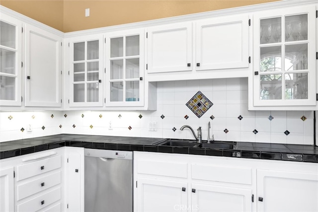 kitchen with stainless steel dishwasher, tile countertops, and white cabinetry