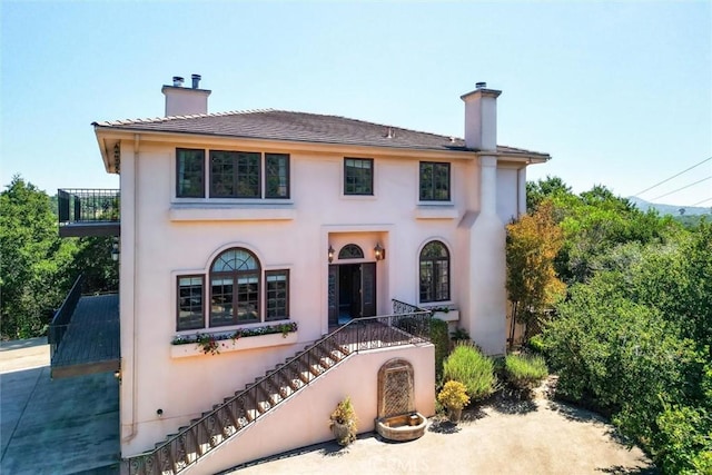 1385 Corberosa Dr, Arroyo Grande, CA 93420 - mediterranean / spanish-style house with stairway, stucco siding, and a chimney