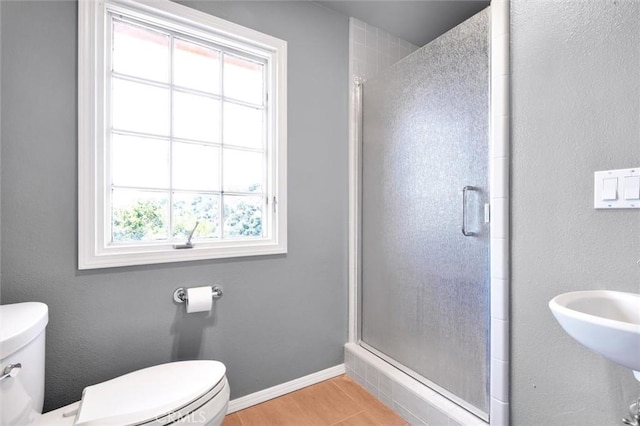1385 Corberosa Dr, Arroyo Grande, CA 93420 - bathroom with baseboards, a stall shower, toilet, a sink, and wood finished floors