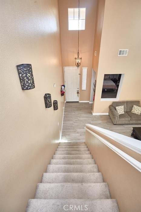 staircase featuring wood-type flooring