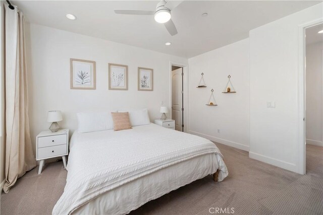 carpeted bedroom with ceiling fan