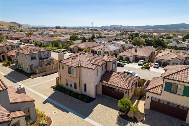 birds eye view of property featuring a mountain view