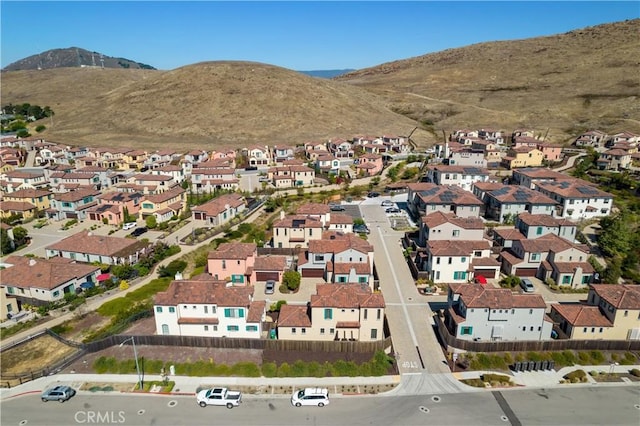 birds eye view of property featuring a mountain view