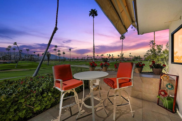 patio terrace at dusk with a lawn