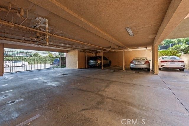 view of vehicle parking with a carport