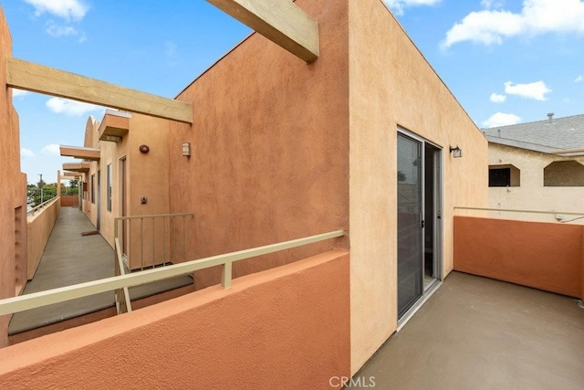 view of side of property featuring a balcony