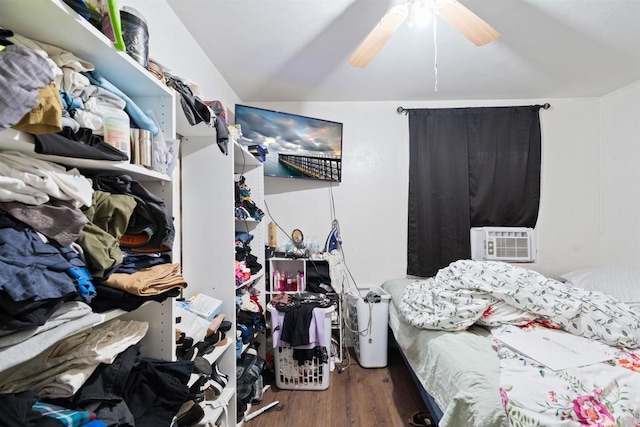 bedroom featuring cooling unit, vaulted ceiling, ceiling fan, and dark hardwood / wood-style flooring