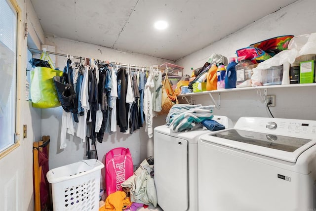 laundry room featuring washing machine and clothes dryer