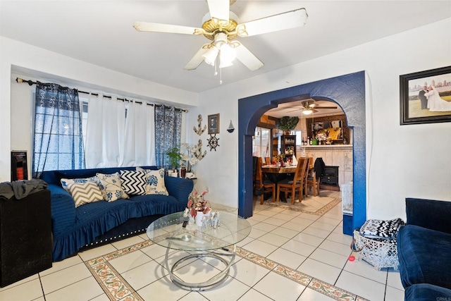 tiled living room featuring ceiling fan