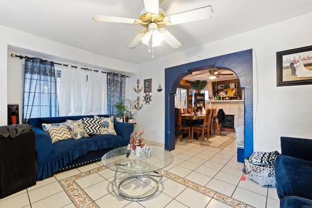 3838 Van Dyke Ave, San Diego, CA 92105 - living area with tile patterned floors, a ceiling fan, and arched walkways