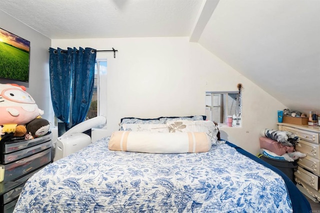 bedroom with vaulted ceiling with beams