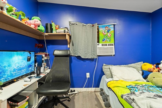 bedroom featuring cooling unit and hardwood / wood-style flooring