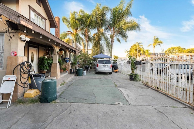 3838 Van Dyke Ave, San Diego, CA 92105 - view of side of property featuring stucco siding, fence, and driveway