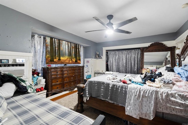 carpeted bedroom featuring ceiling fan