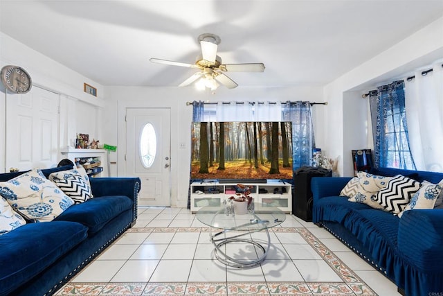 tiled living room with ceiling fan