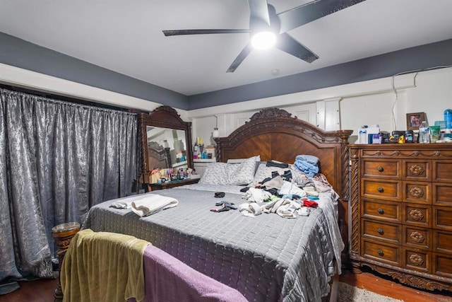 bedroom featuring wood-type flooring and ceiling fan