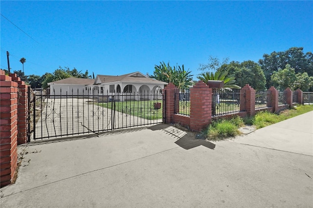 view of gate with a garage