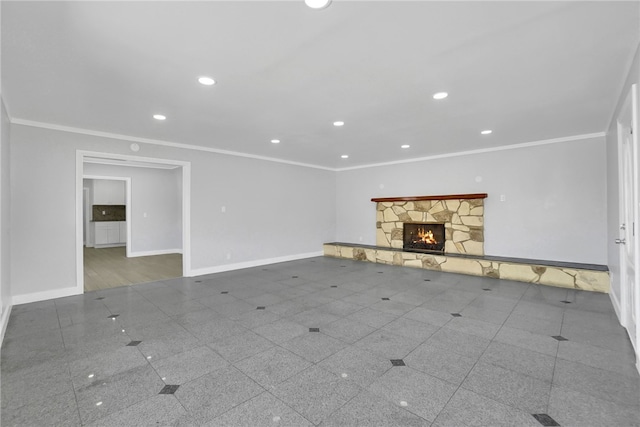 unfurnished living room featuring a fireplace and crown molding