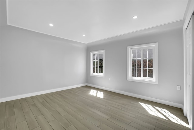 unfurnished room with light hardwood / wood-style flooring